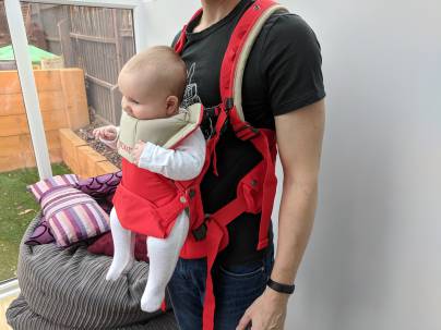 Baby front facing in a carrier