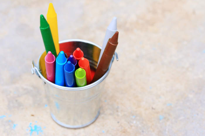 wax crayons in a metal pot