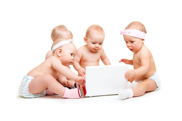 4 toddlers on a laptop