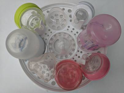 A microwave sterilizer full of bottles