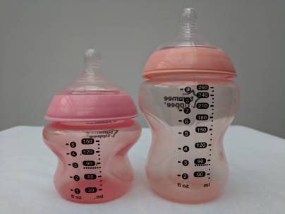 A 5oz and an 11oz Tommee Tippee bottle