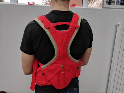 A baby carrier with joined shoulder straps and good back support (ideal for dads)