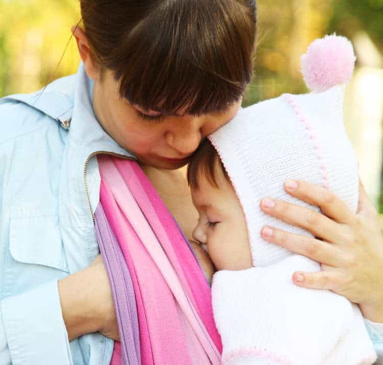 Baby feeding in carrier