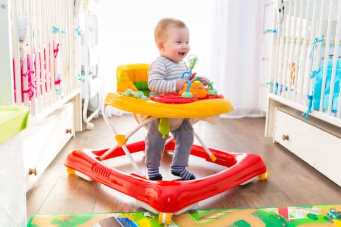 A baby in a seated walker