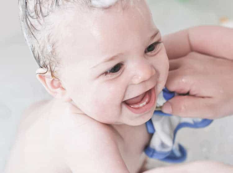 Washing a baby with a washcloth