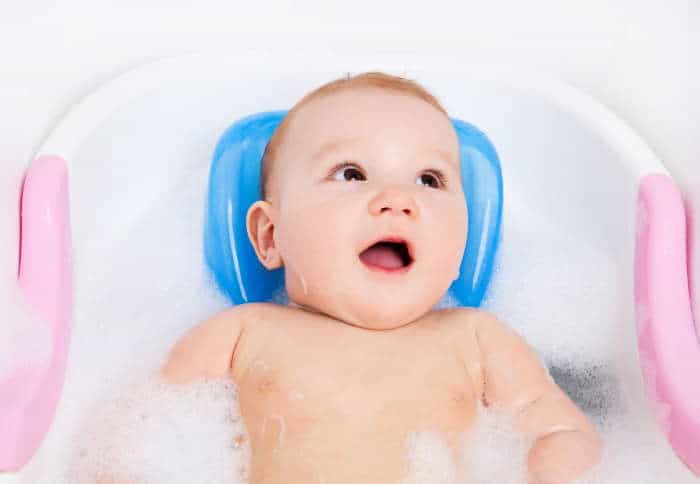 baby in a bath support seat