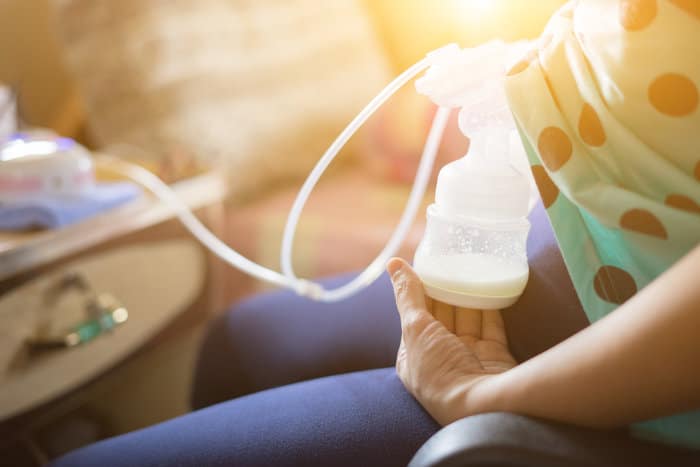 A electric breast pump in use