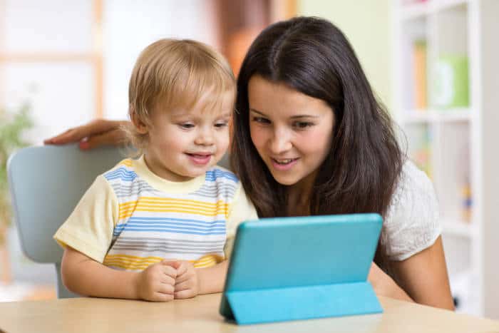 toddler supervised on tablet computer