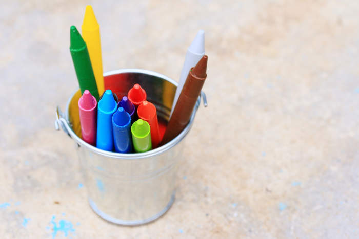 Kids crayons in a metal pot