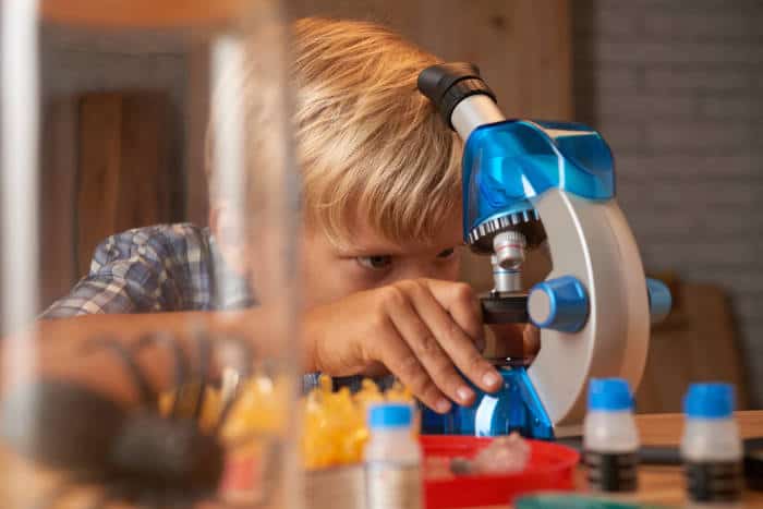 boy with microscope