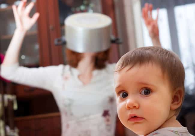 Mom with a saucepan on her head and concerned baby!