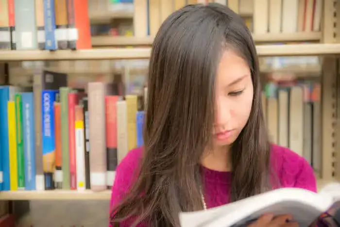 Girl reading in a library